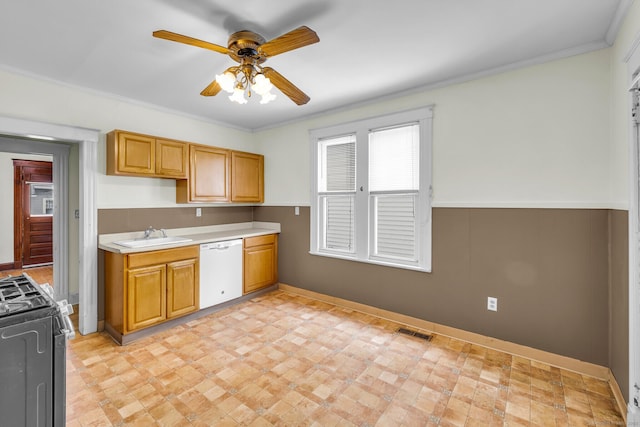 kitchen featuring light countertops, visible vents, black gas range, a sink, and dishwasher