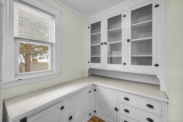 unfurnished office featuring crown molding