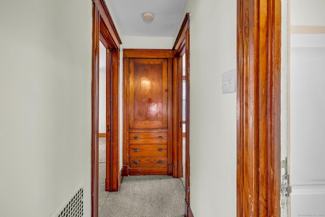 corridor with carpet floors and visible vents