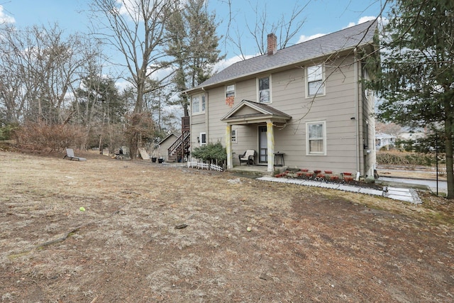 view of front of property featuring a chimney