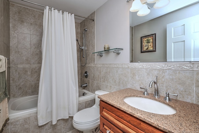 bathroom featuring tile patterned flooring, toilet, vanity, tiled shower / bath combo, and tile walls