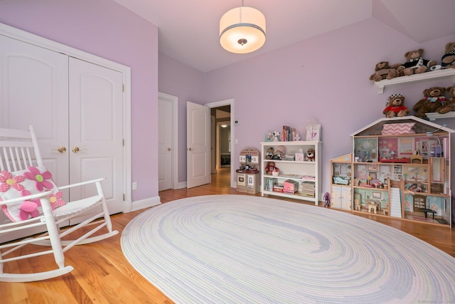 game room featuring baseboards and wood finished floors