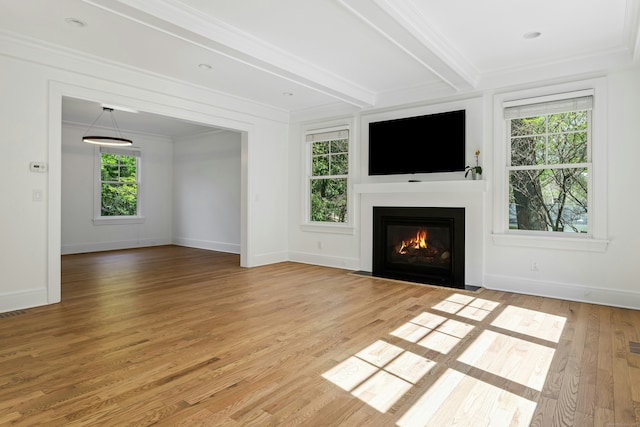 unfurnished living room featuring crown molding, light wood-style flooring, beamed ceiling, baseboards, and a fireplace with flush hearth