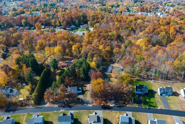 aerial view featuring a residential view and a view of trees