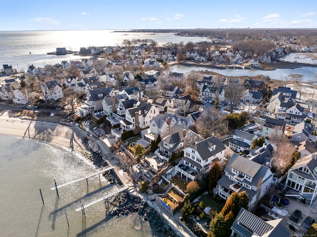 drone / aerial view with a water view and a residential view