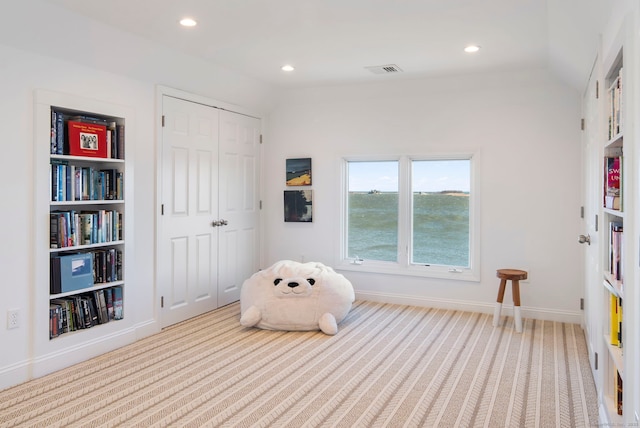 living area featuring carpet floors, visible vents, vaulted ceiling, and recessed lighting