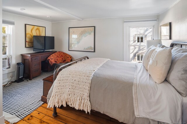 bedroom featuring crown molding and hardwood / wood-style floors