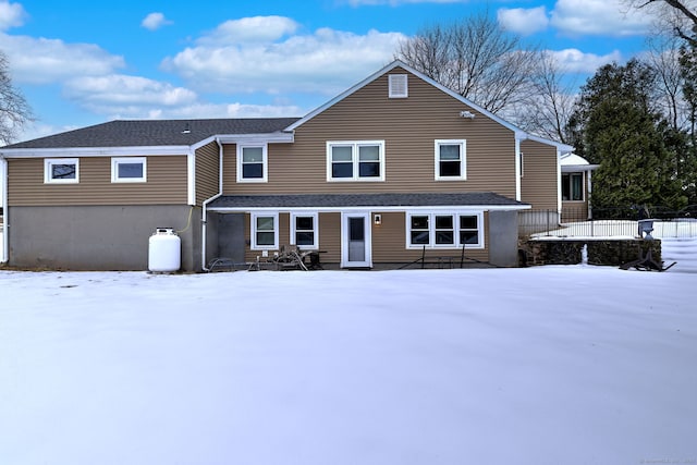 view of front of property featuring roof with shingles