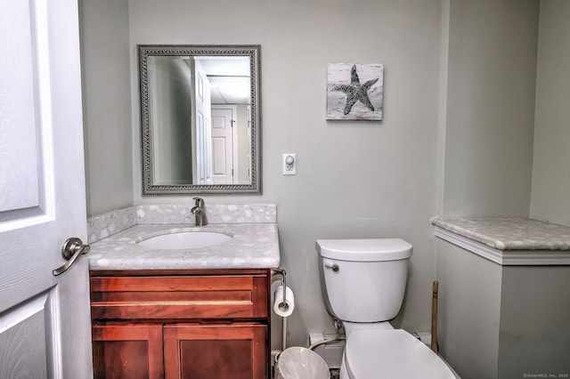 half bath with vanity and toilet