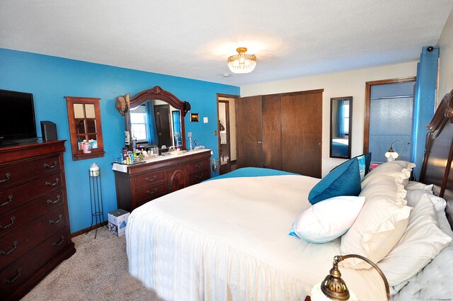 bedroom featuring baseboards and light colored carpet