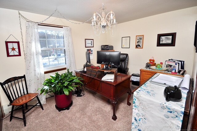 carpeted office space featuring a textured ceiling