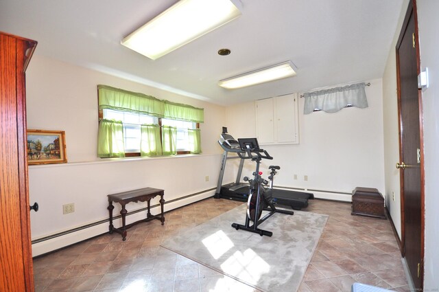 exercise area featuring a baseboard heating unit