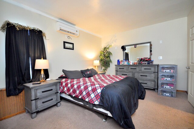 carpeted bedroom with a wall unit AC and wooden walls