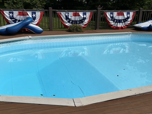 outdoor pool featuring a deck