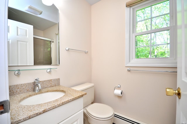 bathroom featuring toilet, a shower with door, and vanity