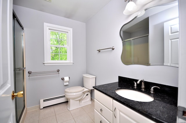 bathroom featuring baseboard heating, baseboards, a shower stall, and vanity