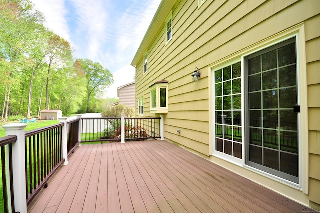 wooden deck with an outdoor structure