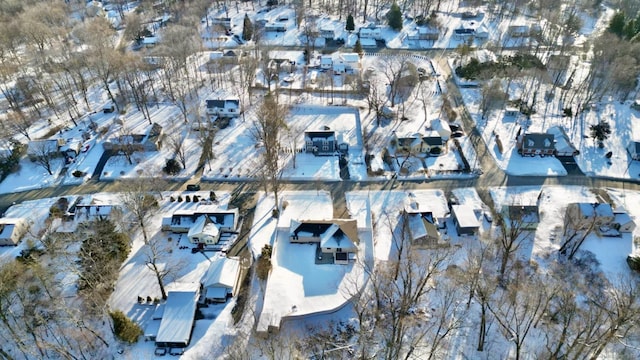 snowy aerial view featuring a residential view