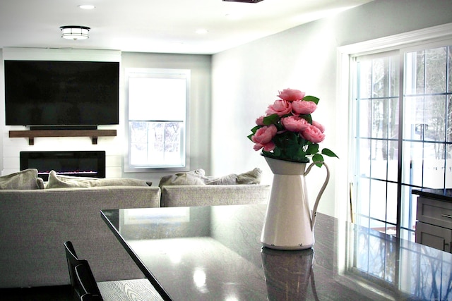 interior space featuring a glass covered fireplace