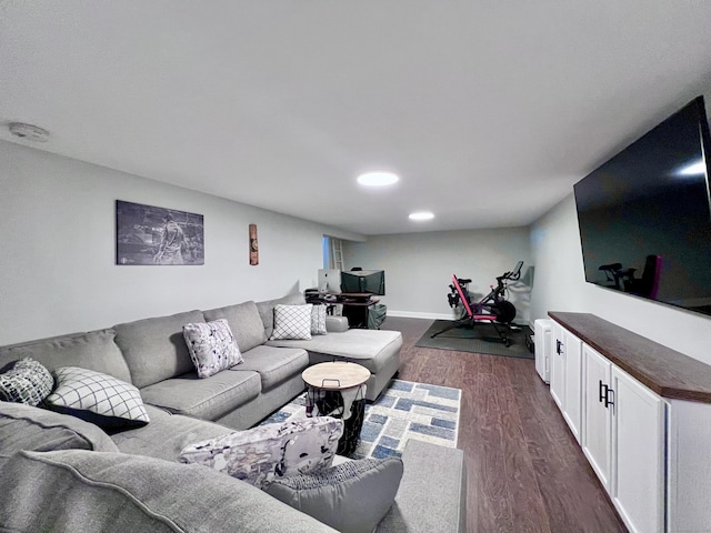 living room featuring dark wood-style flooring and baseboards