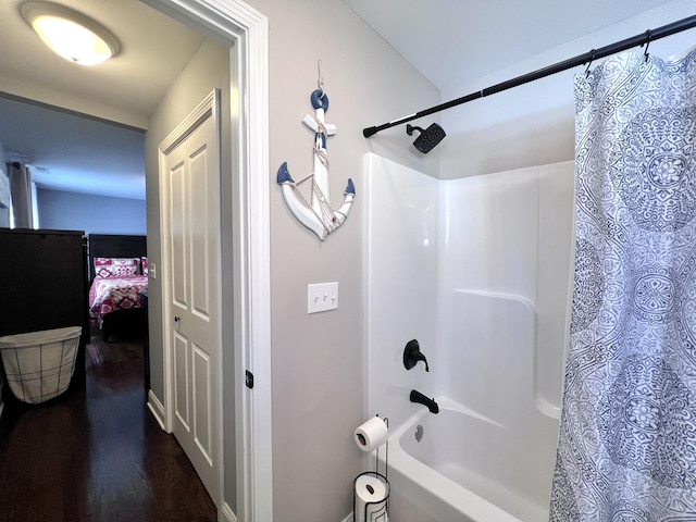 full bathroom with shower / bathtub combination with curtain and wood finished floors