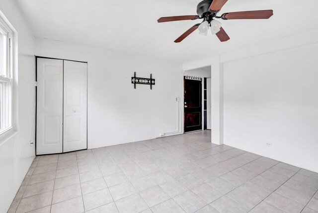 367DBUILDING5 Granfield Ave, Bridgeport, CT 06610 - empty room with a ceiling fan, light tile patterned flooring, and healthy amount of natural light