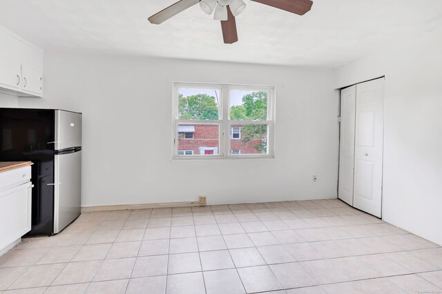 367DBUILDING5 Granfield Ave, Bridgeport, CT 06610 - kitchen with freestanding refrigerator, a ceiling fan, white cabinetry, and light countertops