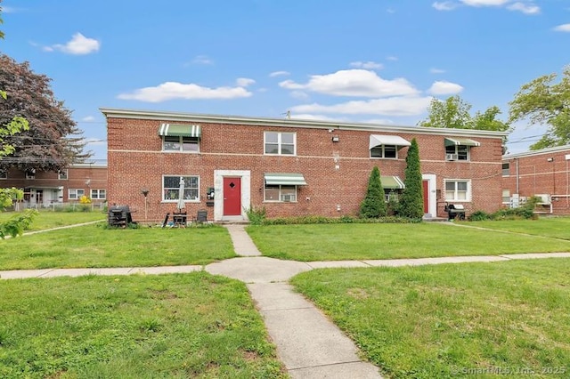 367DBUILDING5 Granfield Ave, Bridgeport, CT 06610 - view of front facade featuring a front lawn and brick siding