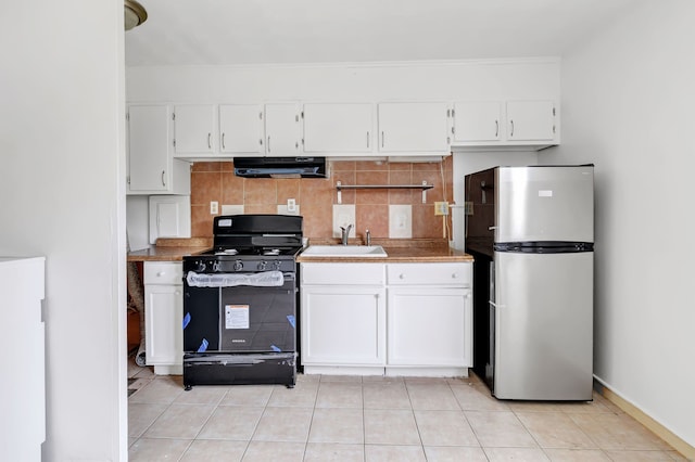 367DBUILDING5 Granfield Ave, Bridgeport, CT 06610 - kitchen with gas range, freestanding refrigerator, under cabinet range hood, a sink, and white cabinetry