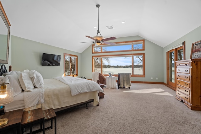 carpeted bedroom with lofted ceiling, a ceiling fan, visible vents, and baseboards