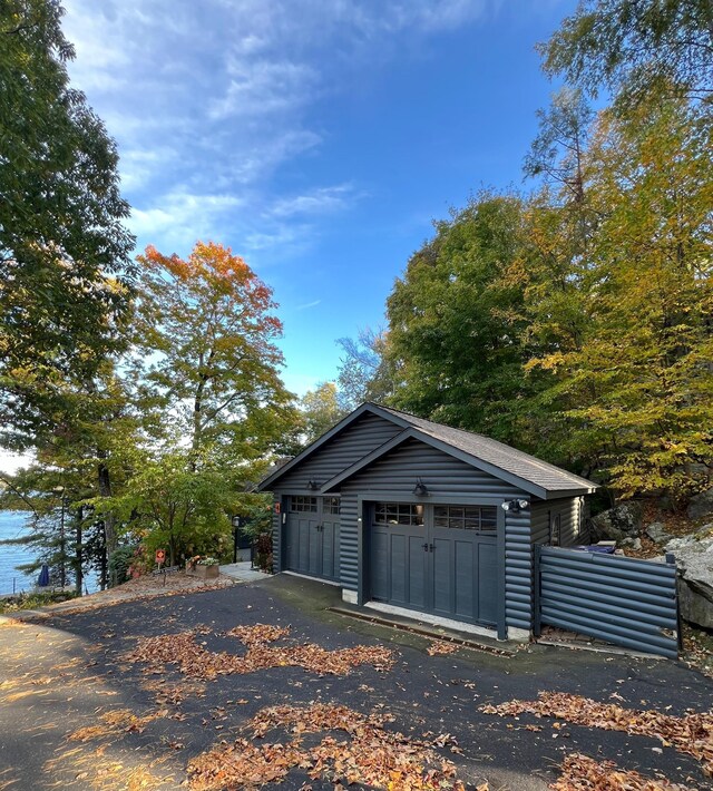 detached garage with a storage shed