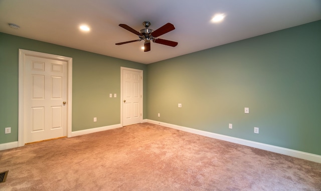 spare room featuring visible vents, baseboards, light colored carpet, ceiling fan, and recessed lighting