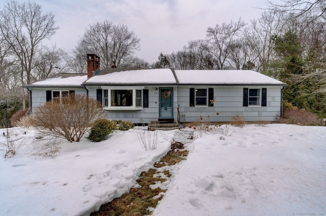 single story home with a chimney