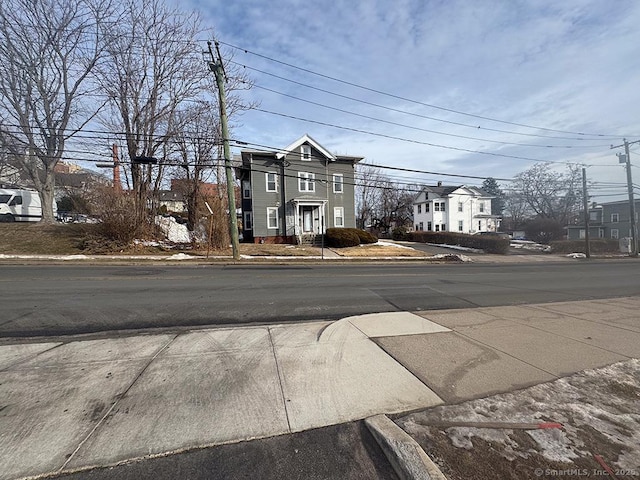 view of road featuring curbs and sidewalks