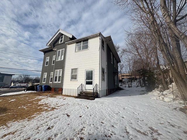 view of snow covered house