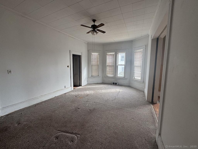 empty room with light carpet and ceiling fan