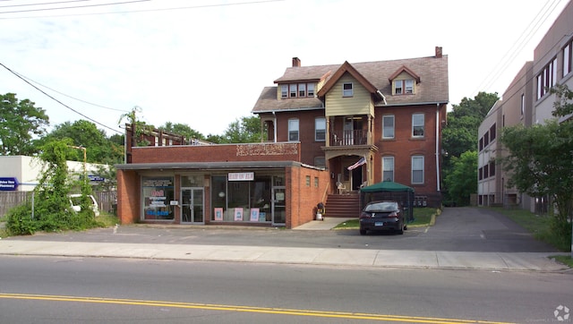 view of front of home featuring brick siding