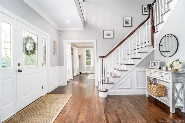 55 Country Woods Ln, Southbury, CT 06488 - entrance foyer with a decorative wall, a wainscoted wall, dark wood-style flooring, stairs, and ornamental molding