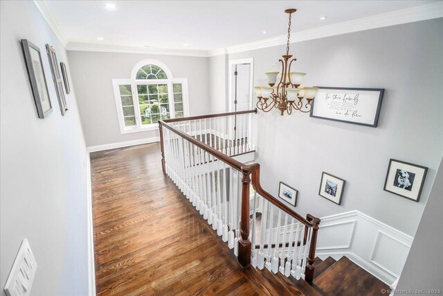 55 Country Woods Ln, Southbury, CT 06488 - interior space featuring a decorative wall, a wainscoted wall, a notable chandelier, wood finished floors, and ornamental molding