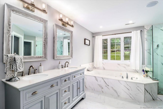 55 Country Woods Ln, Southbury, CT 06488 - full bathroom featuring marble finish floor, a garden tub, a sink, and visible vents