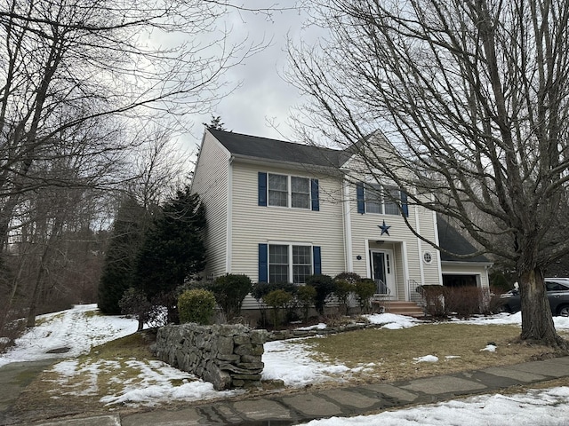 colonial home featuring a garage