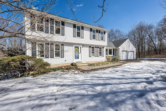 colonial-style house featuring an attached garage