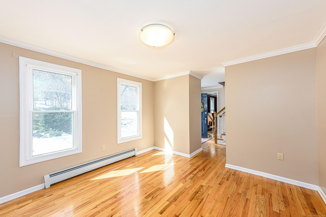 unfurnished room with light wood-style floors, baseboards, ornamental molding, and baseboard heating