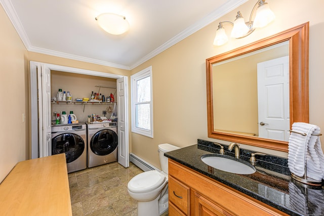 bathroom featuring crown molding, toilet, baseboard heating, vanity, and separate washer and dryer