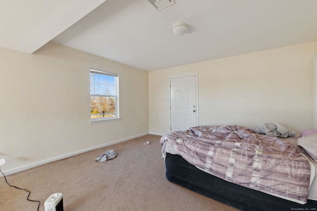 bedroom with visible vents, baseboards, and carpet