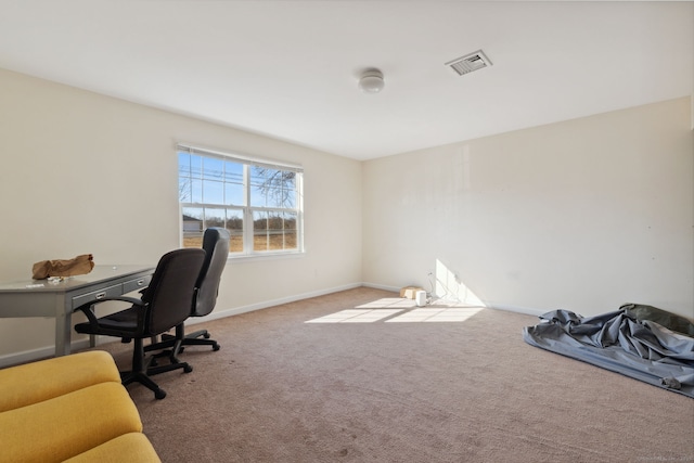 office space with baseboards, visible vents, and carpet floors