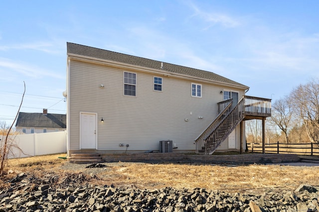 back of house with central AC unit, fence, stairs, entry steps, and a deck