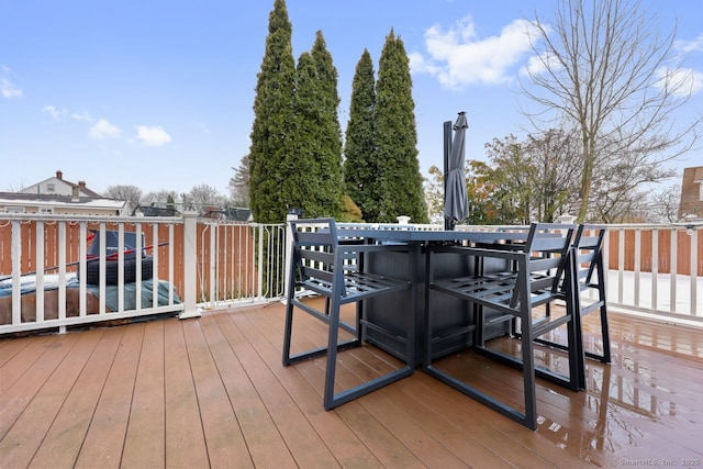 wooden terrace with outdoor dining area