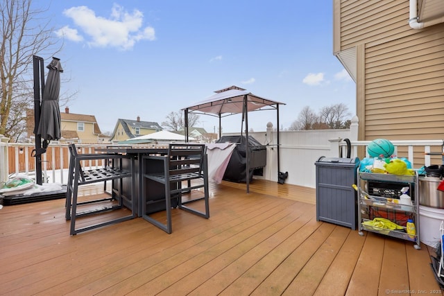 wooden deck featuring grilling area