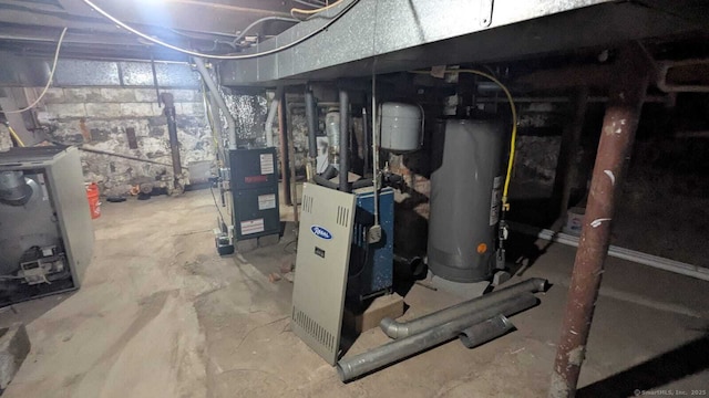 utilities featuring gas water heater and a heating unit